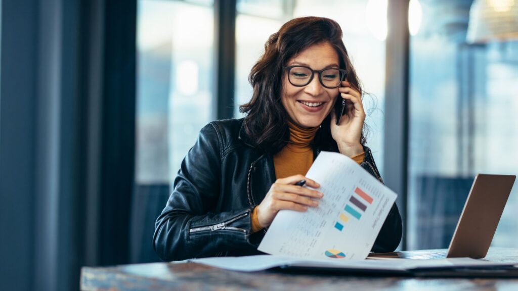 Woman happy on a business call