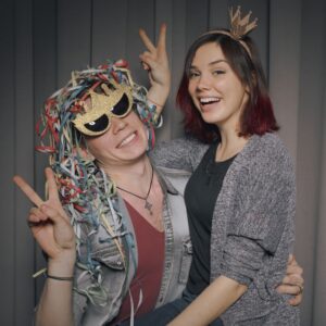 A couple creating lasting memories at a photo booth.