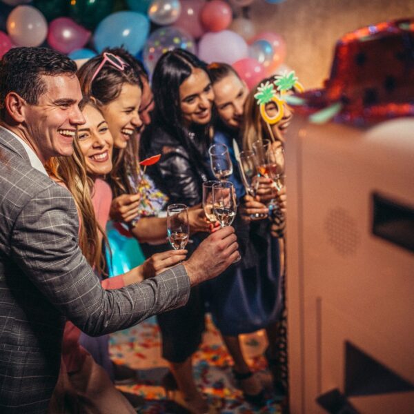 group of dressed up people taking a photo at a party