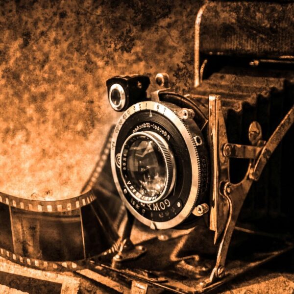 black and white photo of an old time film camera