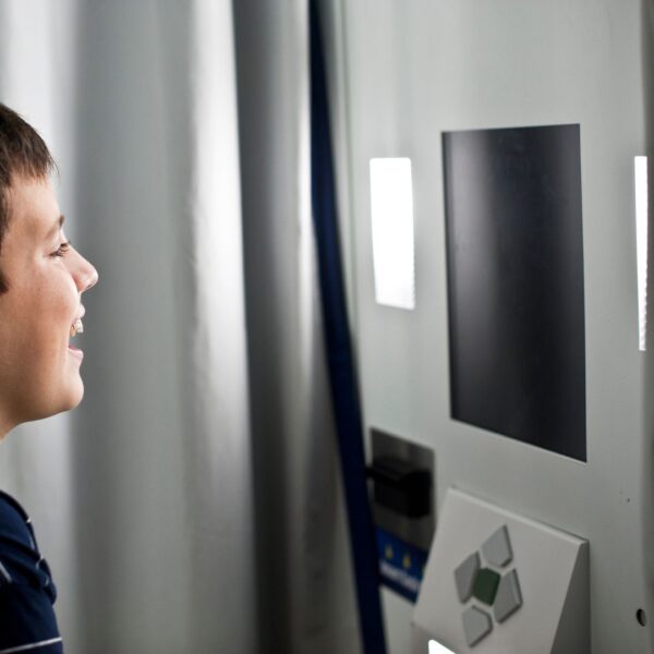 Young boy enjoying an interactive photo kiosk experience