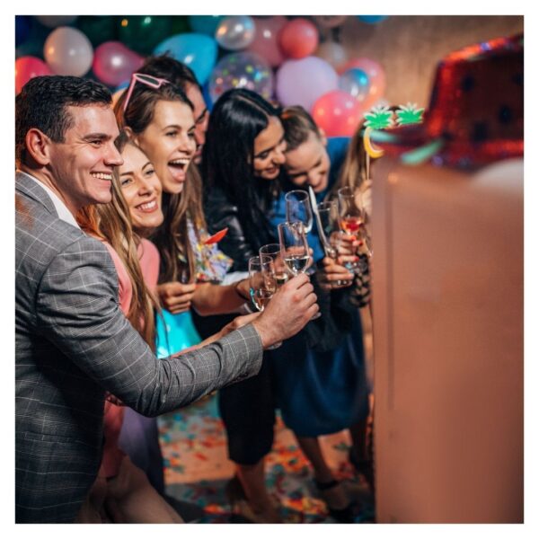 A group poses for a photo booth photo