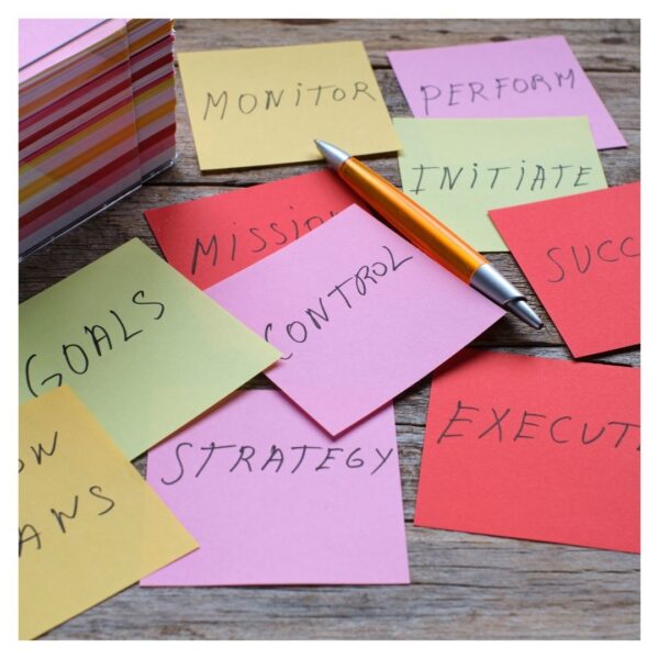 Sticky notes that read "goals, strategy, mission"