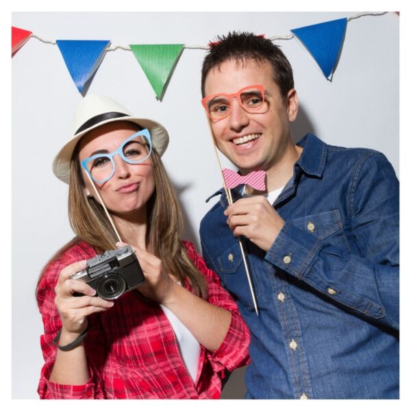 A couple poses for a photo booth photo