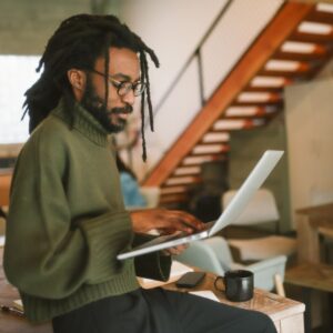 A young professional working on a laptop