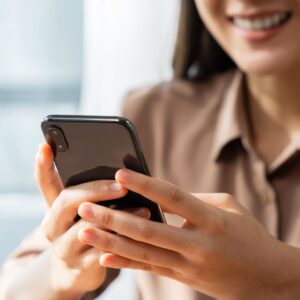 Woman leveraging social media on her phone